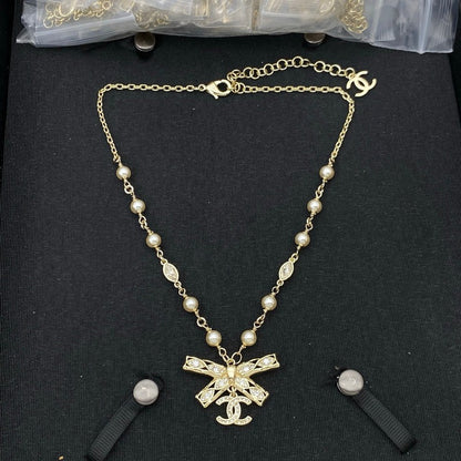 18K  Chanel Bow Tie Diamond Gold Necklace