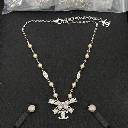 18K  Chanel Bow Tie Diamond Gold Necklace