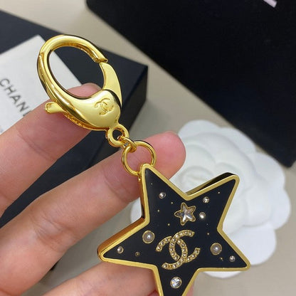 18K  Chanel Black Gold Star Brooch