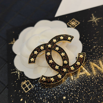 18K  Chanel Black Star Brooch