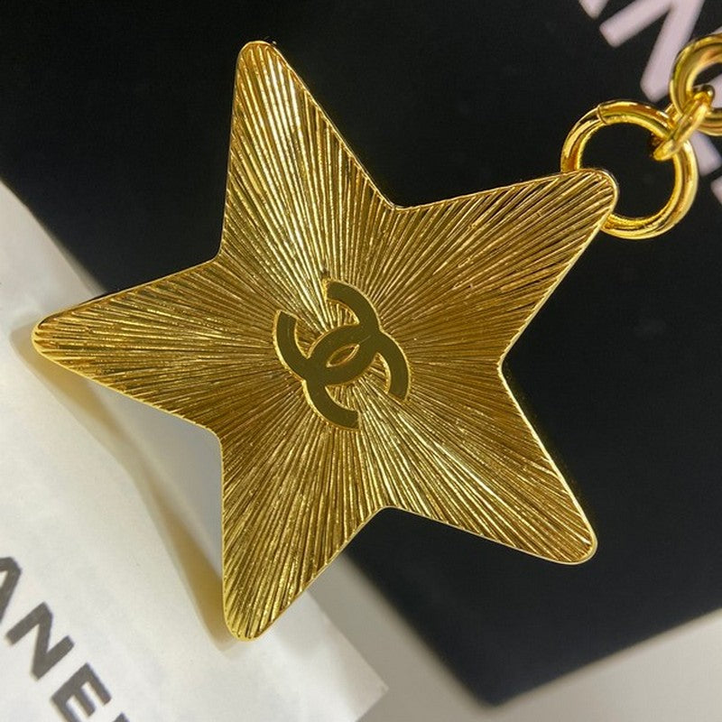 18K  Chanel Black Gold Star Brooch