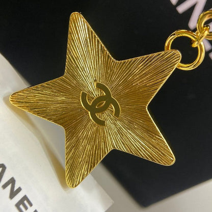18K  Chanel Black Gold Star Brooch